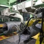 Primetals Technologies e Polytec, soluzione robotizzata per la rifilatura e il campionamento delle bobine